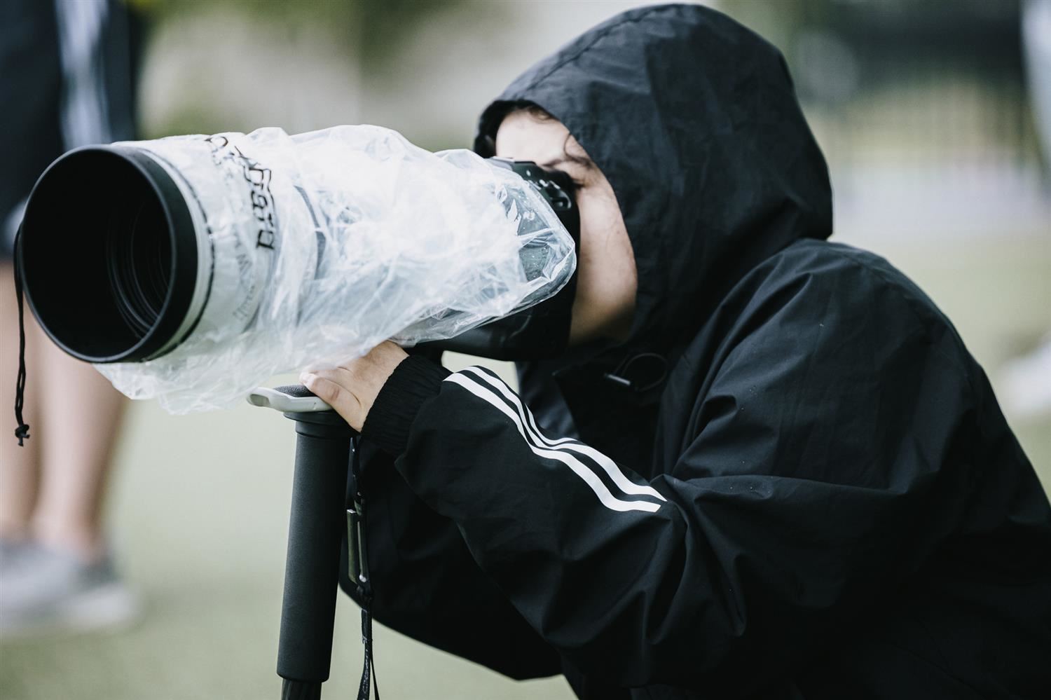 student with big camera 