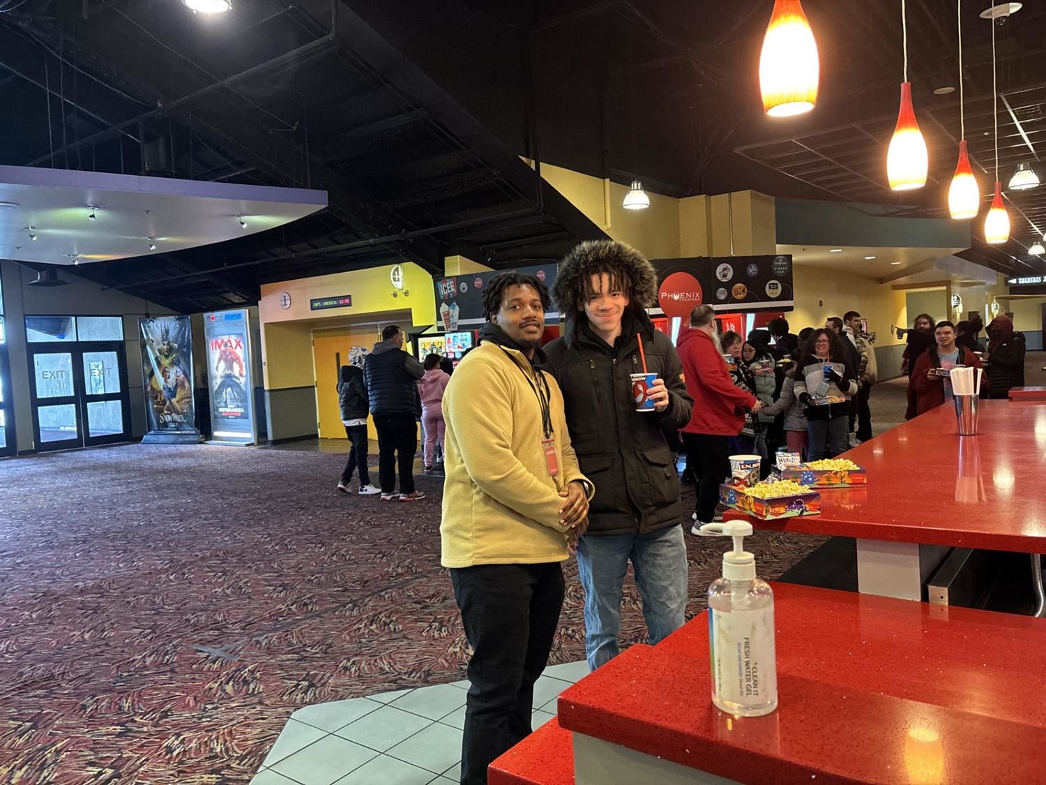 student and teacher at the movies