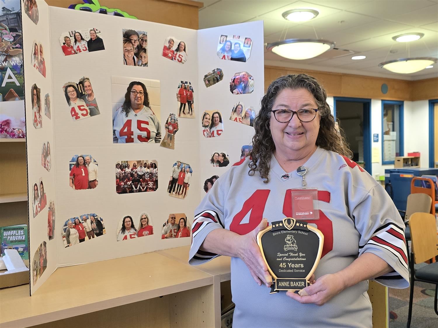 women holding plaque in front of trifold collage
