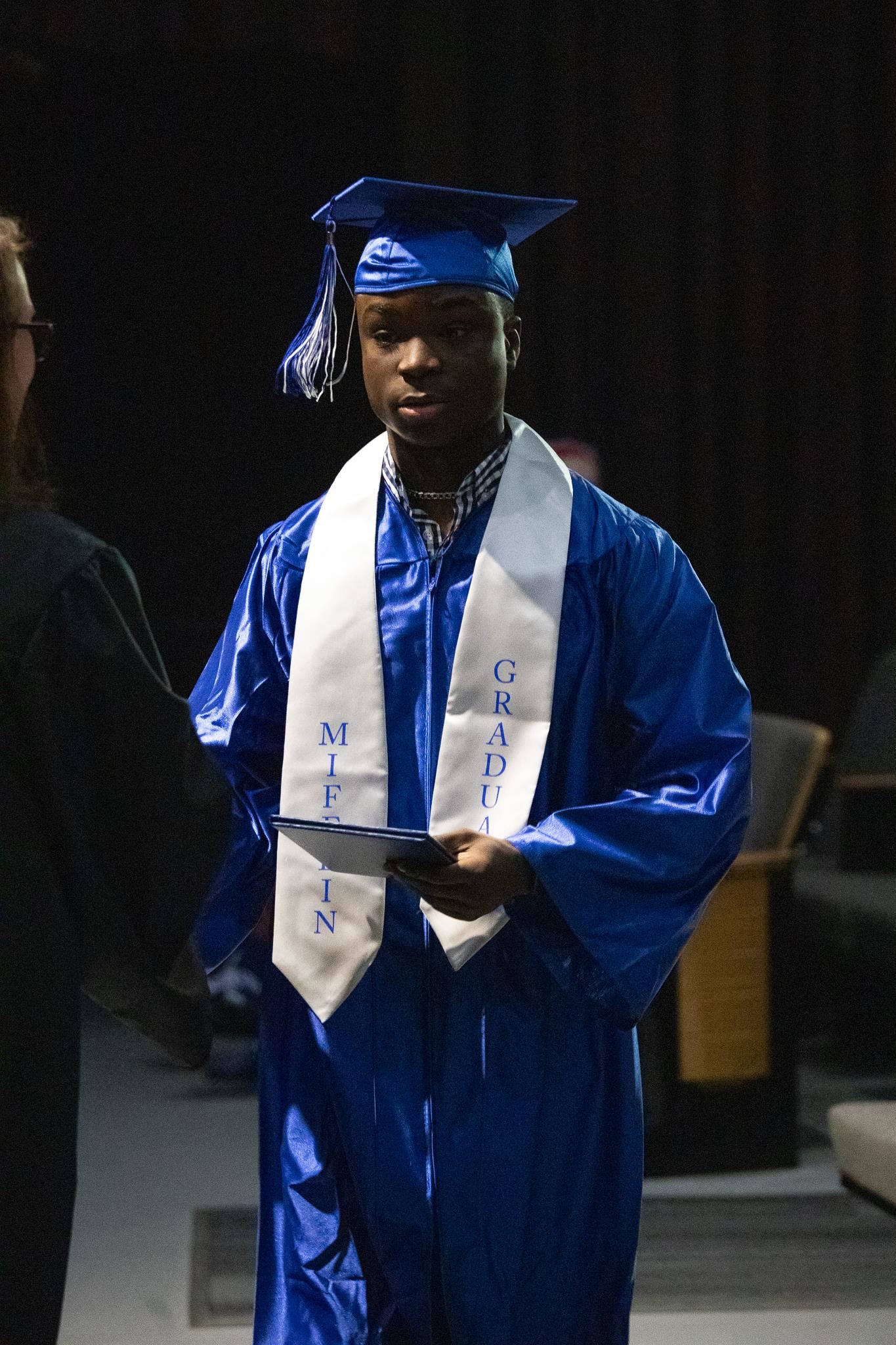 student receiving diploma